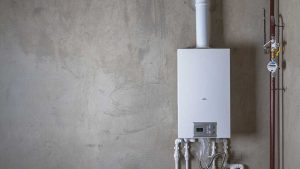 tankless water heater on home wall